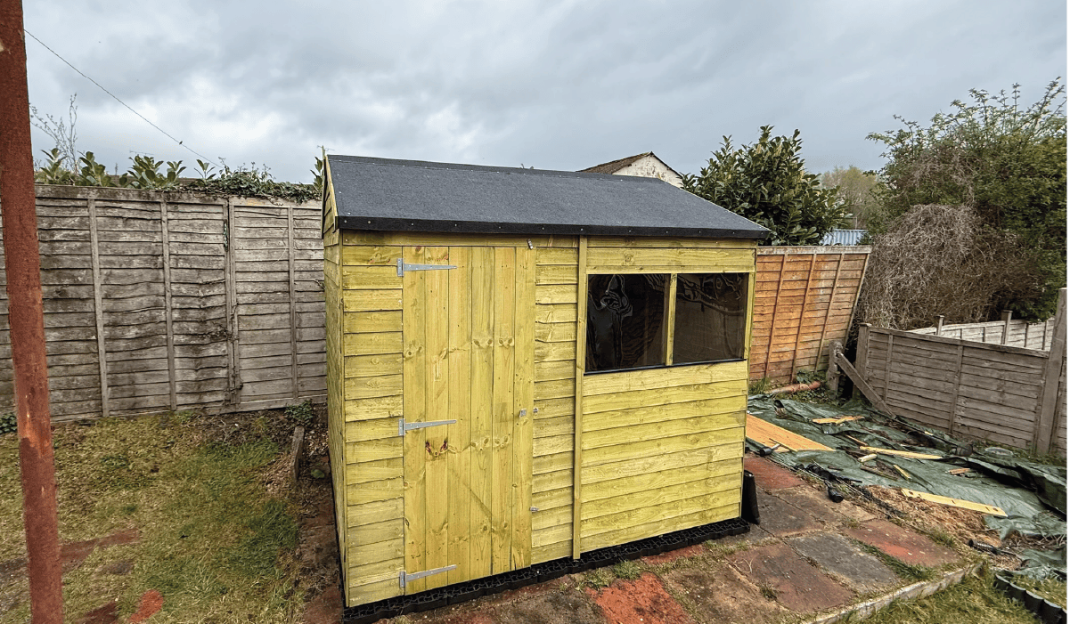 a classic shed assembled in a garden